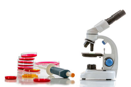 Microscope, on table in medical laboratory, on whiteの写真素材