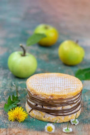 Livarot Cheese traditional Cheese from Normandy France. Colonel, with cider applesの写真素材