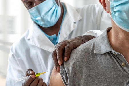 Coronavirus or other disease vaccination to male patientの写真素材