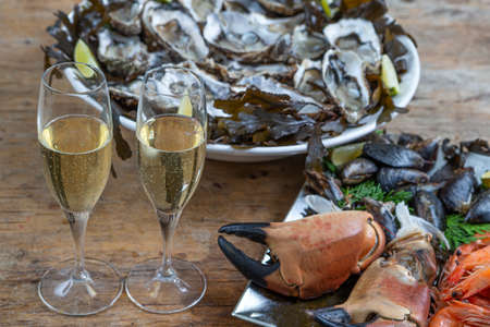 Seafood shellfish plate-Pink prawns, crab claws, Spanish mussels and oysters from Marennes Ol ronの写真素材