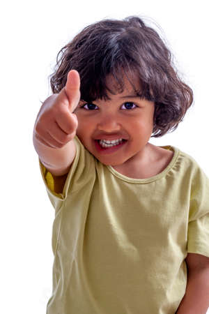 Portrait of a cute african little boy making thumbs up,isolated on whiteの写真素材