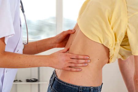 backache woman consultation doctors officeの写真素材