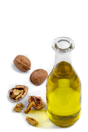 Walnut oil- bottle of walnut oil with freh walnuts aroundの写真素材