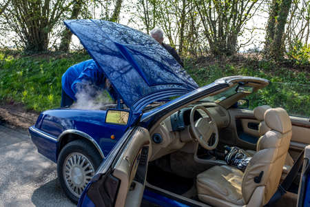 April-03-2022- Vintage car show-France-Bernay-Normandie Overheating of the engine on a car Problems...