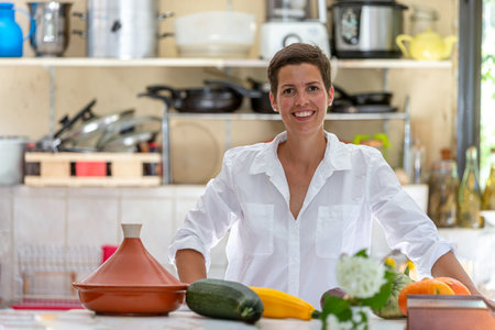 Portrait of a young woman in the kitchenの写真素材