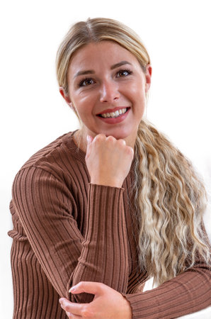 Portrait of a young blonde woman with hair tied up.の写真素材