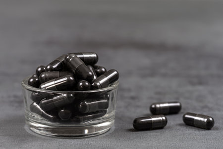 Vegetable charcoal capsules Organic-Food supplementの写真素材