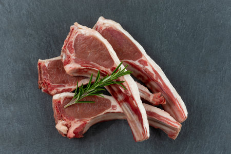 Lamb chops in close-up view from above on a grey backgroundの写真素材