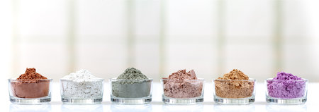 Panoramic clays in glass cups seen in profile on a light background.の写真素材