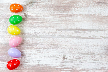 Colorful easter eggs and spring flowers isolated on white background. pastelの写真素材