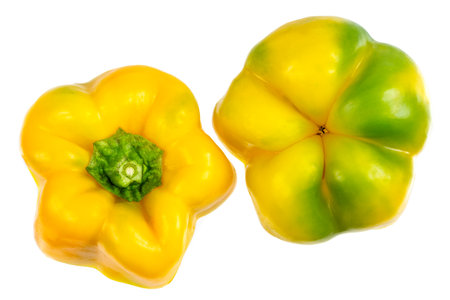 Set of fresh whole and sliced sweet yellow pepper isolated on white background.の写真素材