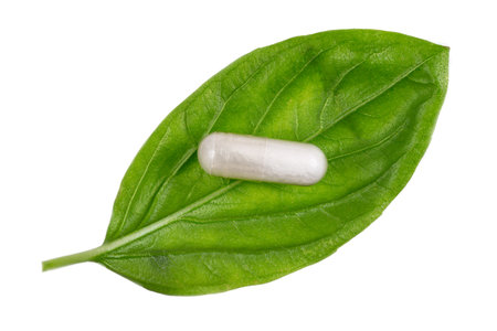 Close up view stevia leaves and pills used as a natural sweetener. Stevia rebaudiana.の写真素材