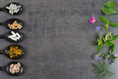Holistic medicine approach. Healthy food eating, dietary supplements, healing herbs and flowers. on greyの写真素材