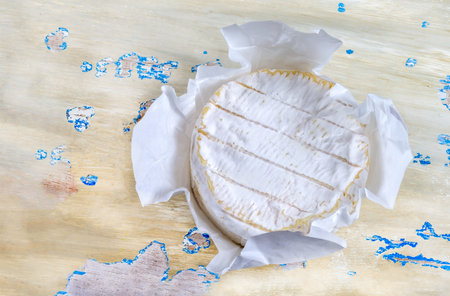 French soft Camembert cheese, original Camembert de Normandie served with fresh ripe figs and grapes, close upの写真素材