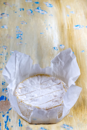 French soft Camembert cheese, original Camembert de Normandie served with fresh ripe figs and grapes, close upの写真素材