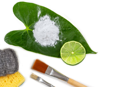 Baking soda, vinegar and cut lemons on white wooden table, flat lay. Sの写真素材