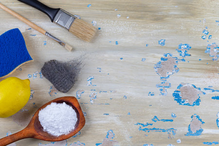 Baking soda, vinegar and cut lemons on white wooden table,の写真素材