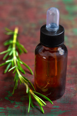 organic cosmetics with herbal extracts of taragon oil on wooden backgroundの写真素材