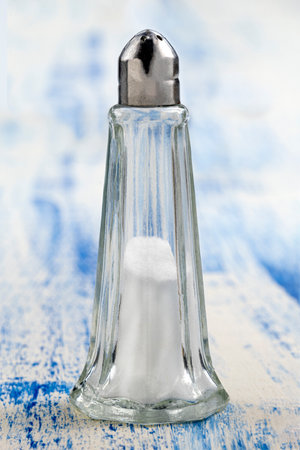Salt realistic set of isolated icons piles of edible salt of different on olld blue wooden backgroundの写真素材