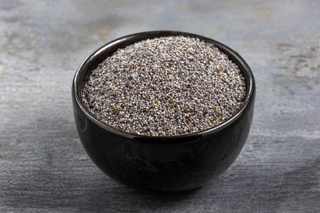 Poppy Seed Isolated, Blue Poppyseed Pile in Wooden Spoon, Small Culinary Grains, Tiny Seeds, Oilseed Sprinkles for Cooking,の写真素材