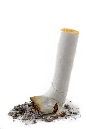 Cigarette stub resting on ash pile after useの写真素材