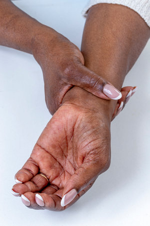 Hands gently clasped together in a calming postureの写真素材