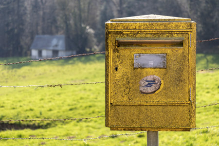 Old yellow mailbox. Normandy , Franceの写真素材