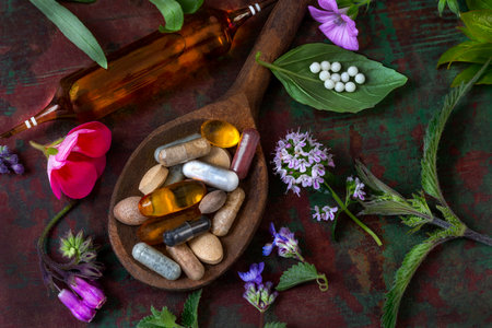 Natural supplements and herbs on a wooden spoonの写真素材