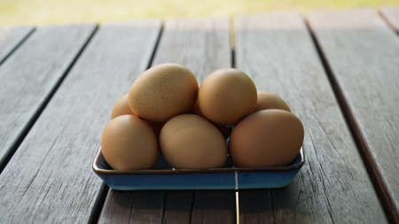 a pile of eggs on a plate in the shade