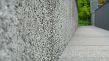 A view of the gray cement corridor from the bottom left.の写真素材