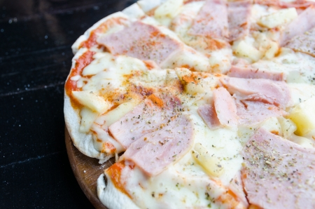 Pizza home made with ham pepper and pine appleの写真素材