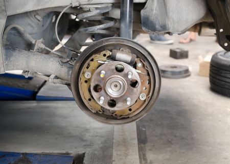Old brake pads and cylinder brake drumの写真素材