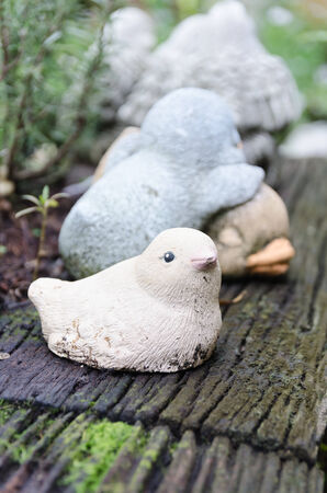 Decorative bird dolls in the gardenの写真素材