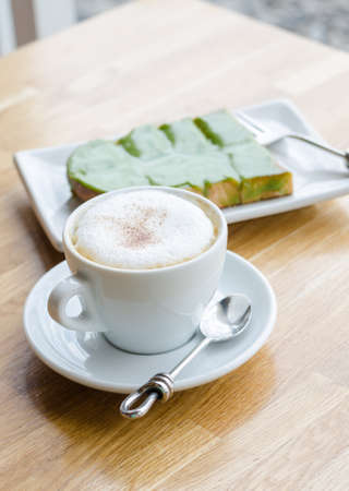 Hot coffee and bread on wood tableの写真素材
