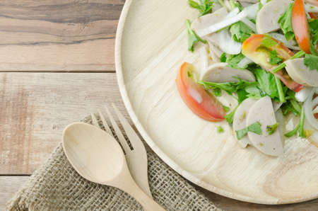 Thai spicy salad on wood tableの写真素材