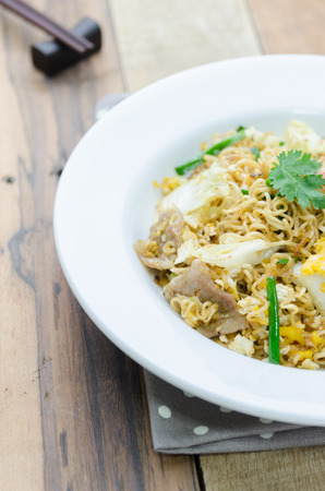 Fire instant noodle on white plateの写真素材