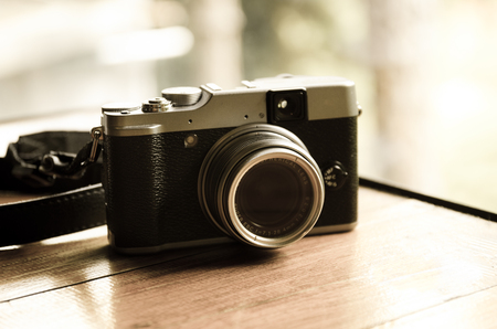 Modern camera in vintage style, process film colorの写真素材