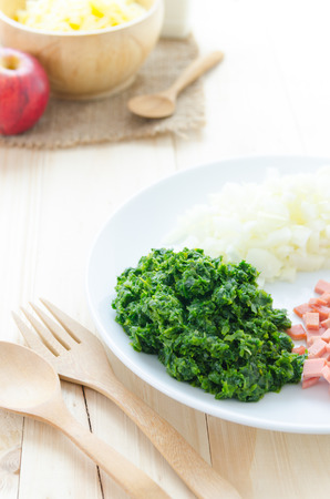 Ingredient of baked spinach with cheeseの写真素材