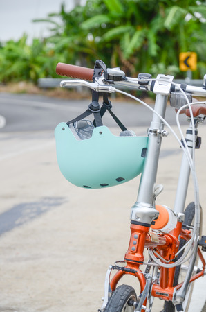 cycling helmet closeup on bicycle outdoorsの写真素材