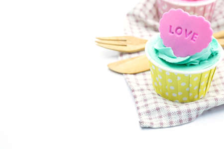 Cup cake and apron, isolated on whiteの写真素材
