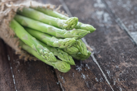 Asparagus on dark wood tableの写真素材