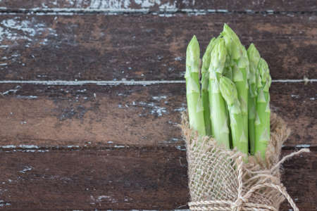 Asparagus on dark wood tableの写真素材