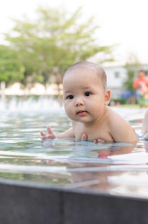 cute baby boy in the pool