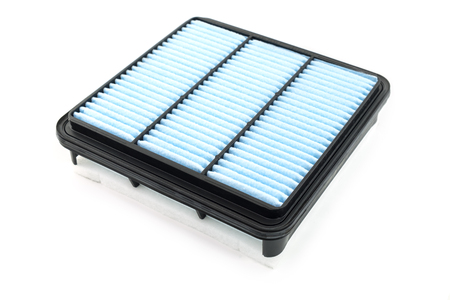 Flat engine air filter in a plastic case on a white backgroundの写真素材