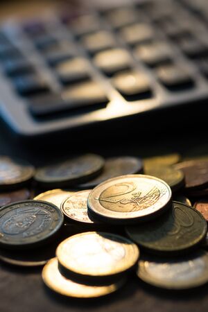 Euro coins with calculator, Money concept, close up euro coins. selective focusの写真素材