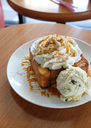 Honey Toast, Consists of bread topped with honey and ice cream on woodの写真素材