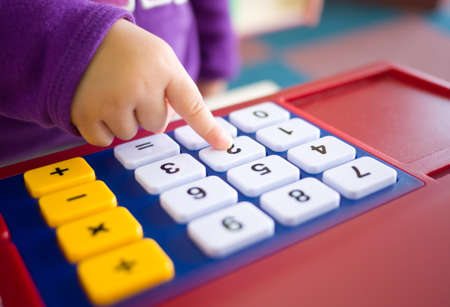 kids finger pressing toy calculatorの写真素材