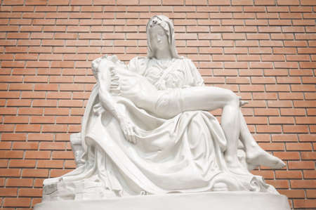 Statue of Mary and Jesus in posture of after crucifixionの写真素材