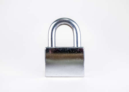 Used, scratchy, silver padlock isolated on white