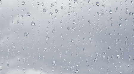 Rain drops on the window  It s going to bright outside の写真素材